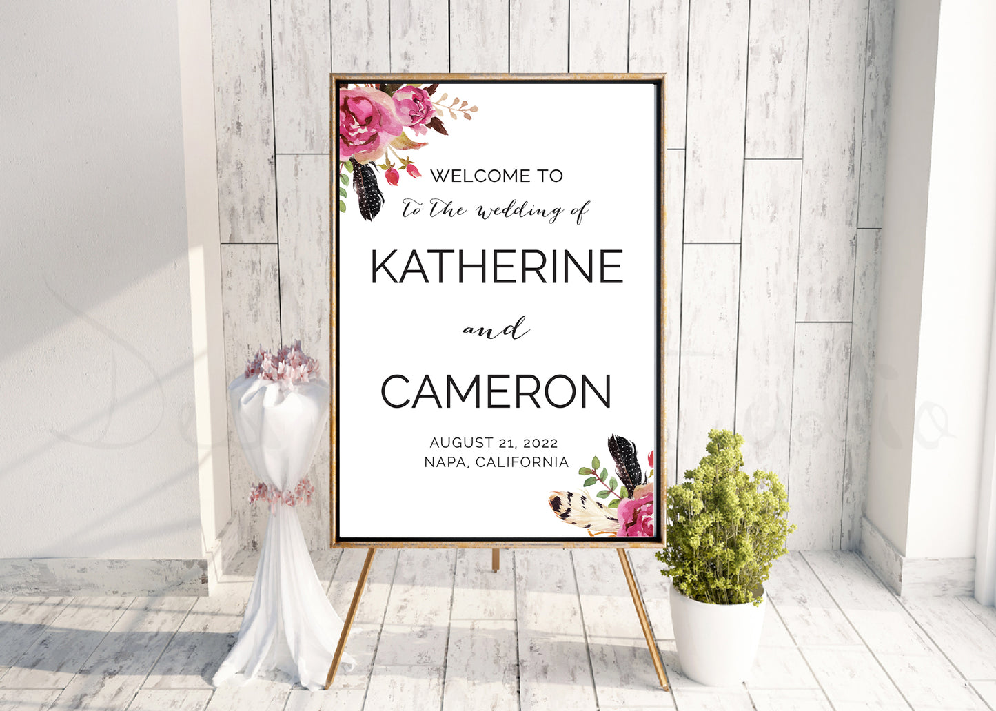 pink flowers and bohemian wedding signage