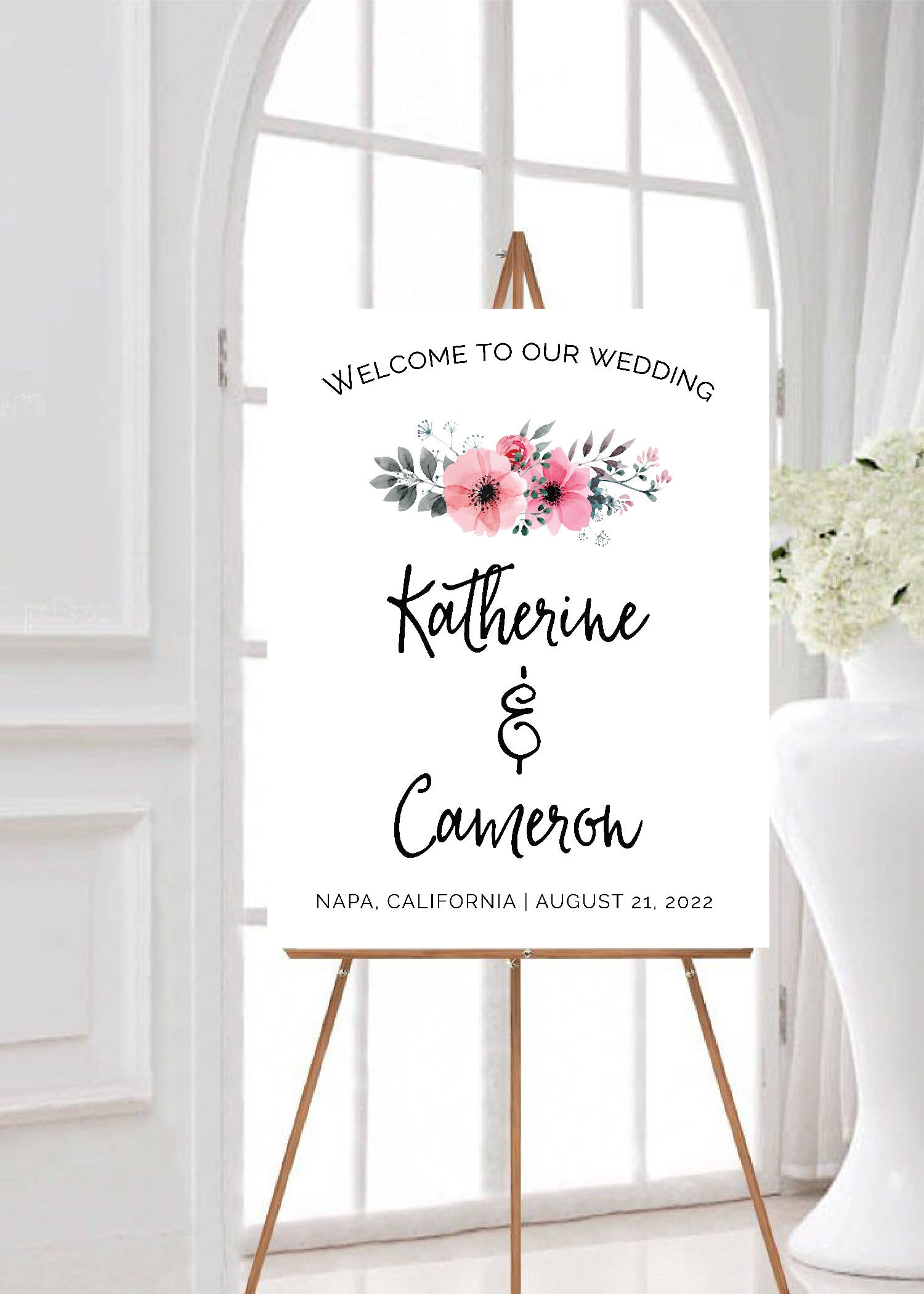 Pink flowers welcome wedding signage